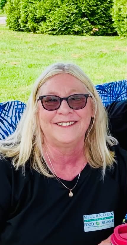 Lori Lazaros smiling outdoors in a Millbrook & District Food Share shirt